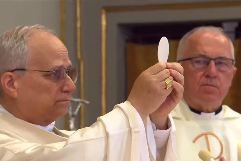 Pope Leo holds back tears during Consecration at Assumption Mass