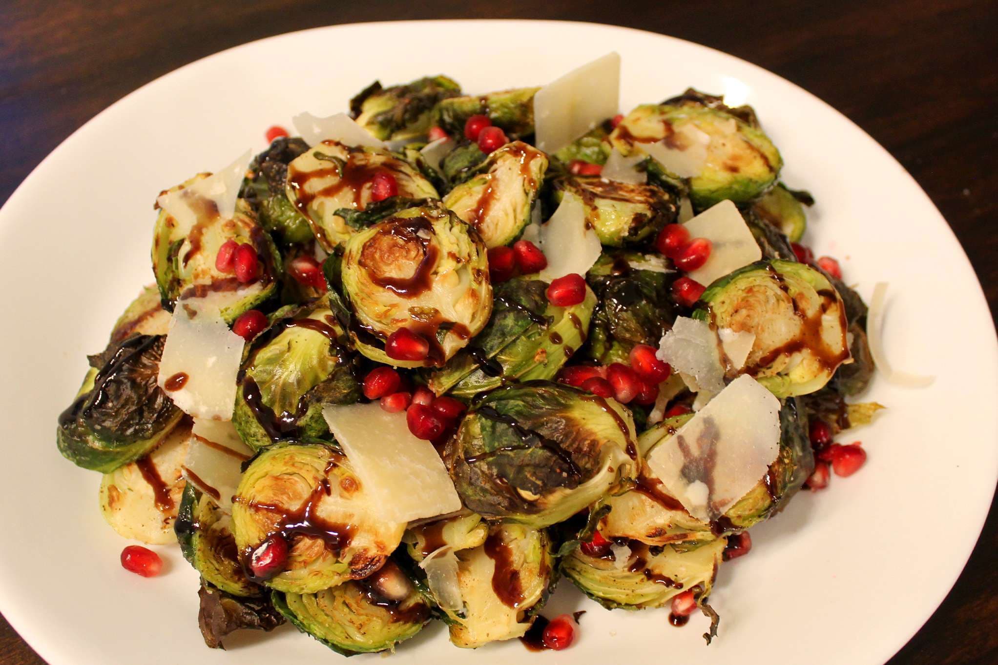 Roasted Brussels sprouts with balsamic glaze, pomegranate, and Parmesan